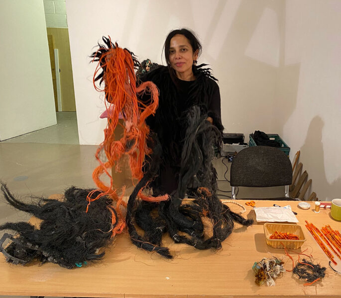 Incubator of Ideas – Madi Acharya Baskerville working on her sculpture