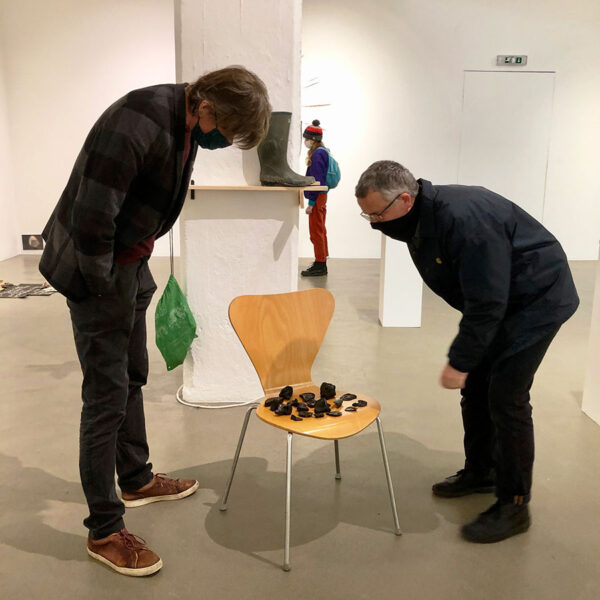 Incubator of Ideas – Tom Banks and gallery visitor examine collected pieces by Mark Sowden